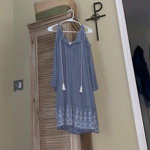 Light blue open shoulder dress with tassels